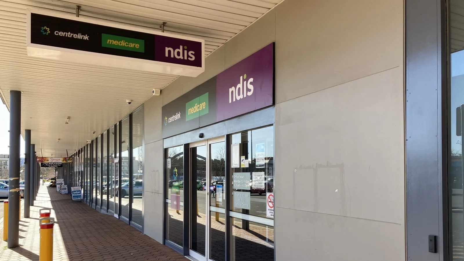 Services Australia service centre entrance in Canberra with Centrelink, Medicare and NDIS signs